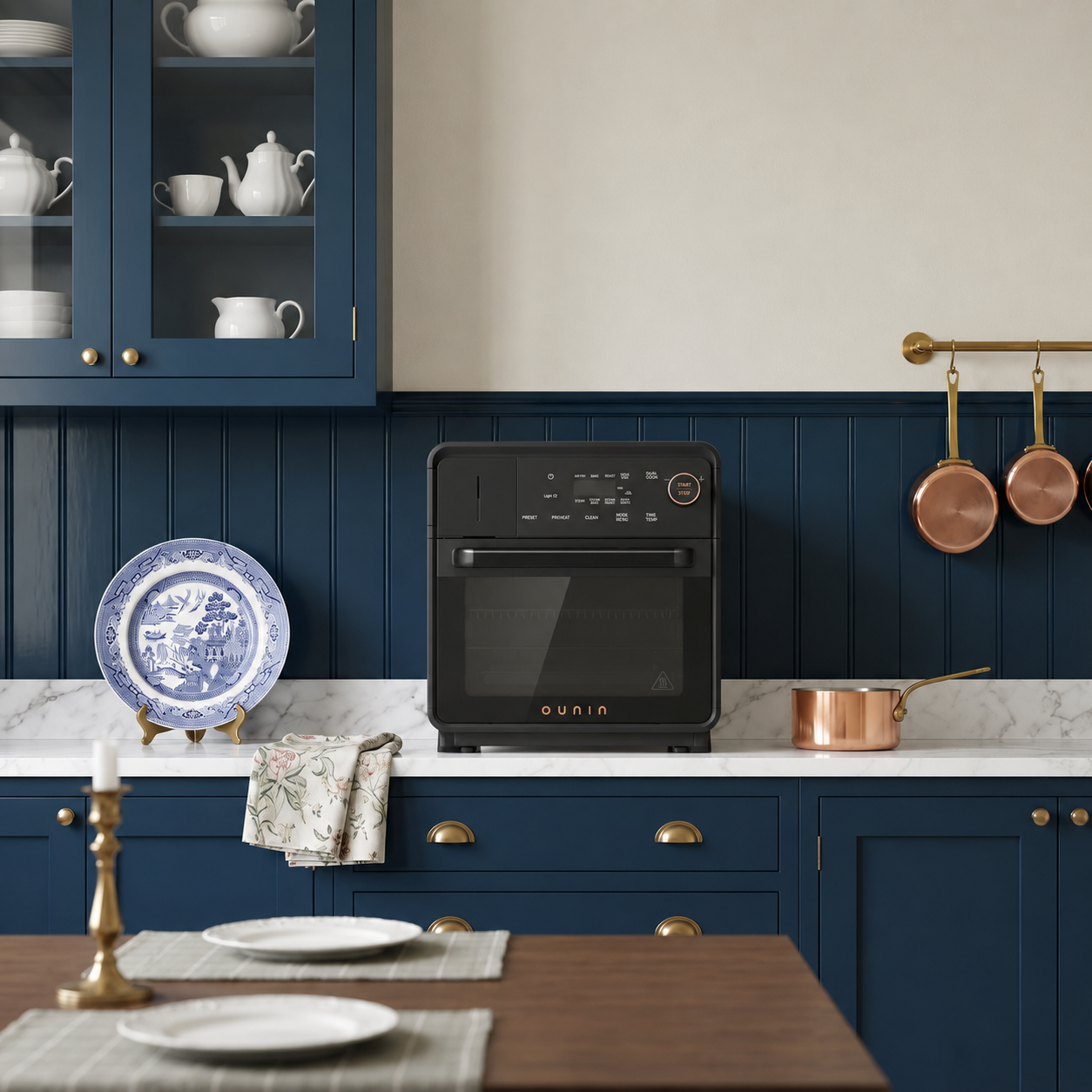 18L Steam Oven against navy beadboard with copper pans
