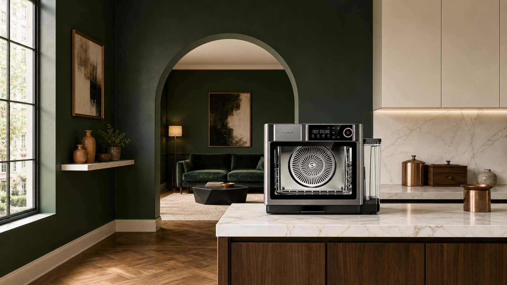 32L Certainty Oven in gunmetal on a marble island in a deep-green kitchen